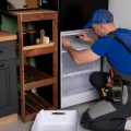 electrical-technician-working-repair-refrigerator-refrigeration-equipment_353017-2305